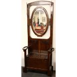 A 1930's oak mirror backed hallstand, H. 86cm.