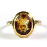 A 9ct yellow gold citrine set ring, (K.5).