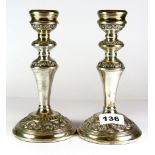 A pair of hallmarked silver candlesticks, H. 18cm.