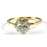 A 9ct yellow gold (stamped 9ct) white quartz set ring, (L.5).