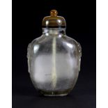 A Chinese carved rutile quartz snuff bottle with lion ring side decoration and banded agate
