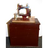 A boxed miniature "Essex" sewing machine.