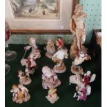 A collection of twelve Continental porcelain and bisque figurines,