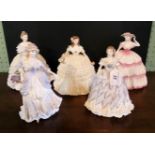 Four Coalport figurines, together with a Royal Worcester figurine.