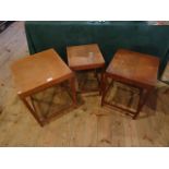 A set of three early 20th century oak stacking side tables (the largest 46cm square).