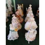 A collection of eight ceramic figurines, to include: four Royal Worcester examples,