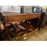 An early 20th century two drawer writing table,