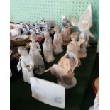 A Lladro Collector's Society plaque, together with nine other Lladro figurines.