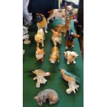 A collection of twelve assorted ceramic animals, to include examples by Sylvac,