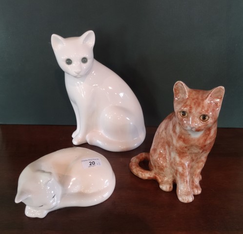 A ginger ceramic cat with glass eyes in the manner of Winstanley (22cm tall),