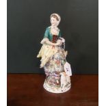 A 19th century Sansom porcelain figurine of a lady holding a tambourine,