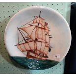 A Moorcroft charger/wall plaque, designed by Sally Tuffin, depicting the galleon HMS Sirius,