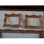 A pair of gilt composite picture frames, having pierced moulded decoration (each 31cm x 38cm).