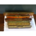 A collection of six wooden and brass mounted spirit levels, early 20th century and later,