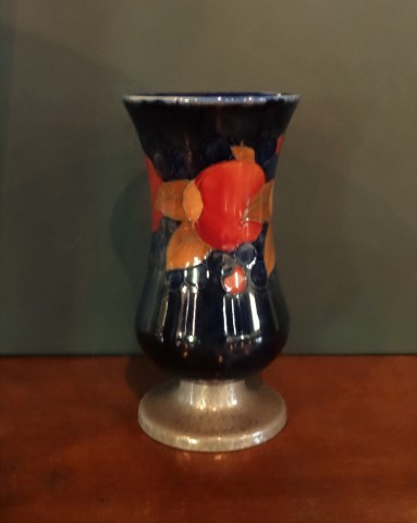 An early 20th century Moorcroft vase in the Pomegranate pattern,