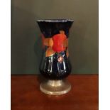 An early 20th century Moorcroft vase in the Pomegranate pattern,