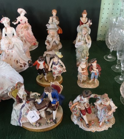 A collection of eight porcelain and bisque Continental figurines,