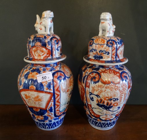 A pair of 20th century Imari baluster jars and covers, having Dog of Fo finial (35cm).