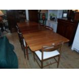 Circa 1970's McIntosh two leaf extending dining table and eight conforming dining chairs,