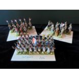 A quantity of painted lead soldiers, various military uniforms, mounted in formation groups to card.