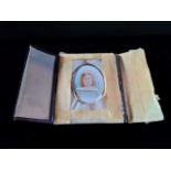 A portrait miniature of a young girl, watercolour,