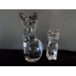 A Daum glass model of a seated cat, together with another smaller, each with acid etched mark,