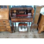 A reproduction cylinder bureau with red tooled leather sliding scriber over single drawer,