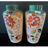A pair of late Victorian opaque glass vases, having painted foliate decoration, (35cm).