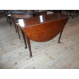 A late Georgian drop-flap mahogany dining table on pad feet, (102cm wide).