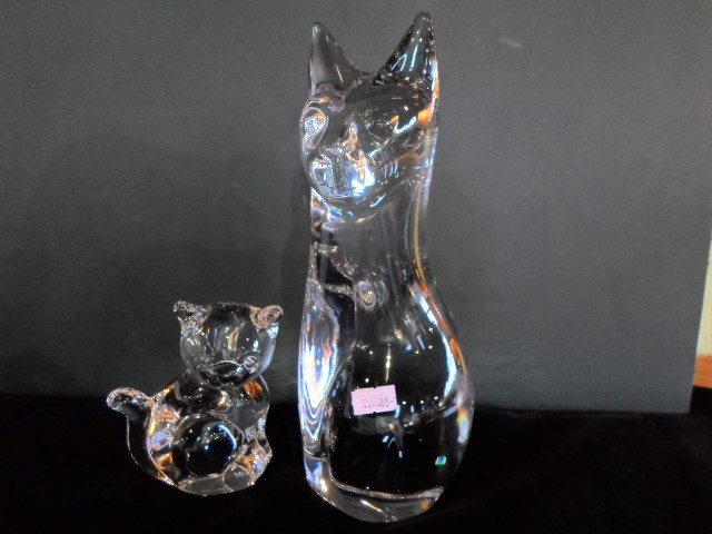 A Daum glass model of a seated cat, together with another smaller, each with acid etched mark,