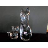 A Daum glass model of a seated cat, together with another smaller, each with acid etched mark,