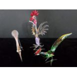 Two Murano-style glass birds, together with another, similar.