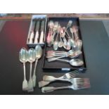 A large quantity of silver flatware, to include: dessert spoons, table spoons and forks,