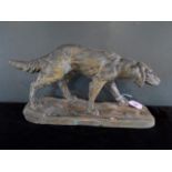 An early 20th century painted terracotta model of a dog, after E.