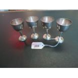 A set of four Mexican silver miniature goblets, (7.5cm).