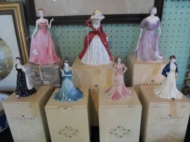 A collection of seven Coalport figurines, each with original box,