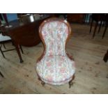 A Victorian lady's button back upholstered fireside chair, (56cm wide).