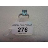 A single stone aquamarine ring, the rectangular step cut cut cornered aquamarine with claw mounts,