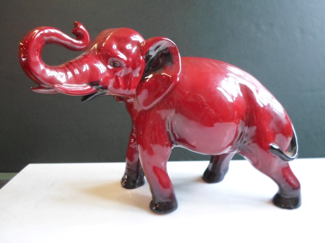 A Royal Doulton Flambé glazed model of an elephant, (19cm x 13cm).