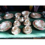 A contemporary Franciscan hand decorated part-dinner service, comprising: dinner plates, trios,