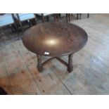 A 20th century circular coffee table on quatrefoil base, (76cm diameter).