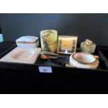 A mixed lot to include: Limoges porcelain box, onyx ashtrays, a Luxor travelling clock,