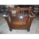 An early 20th century oak hallstand/single seater bench,