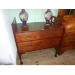 An early 20th century mahogany Arts & Crafts-style two drawer chest, having galleried sides,
