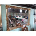 A large contemporary gilt framed mirror,