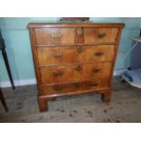 An 18th century and later four drawer chest, walnut, having extensive modifications and repair,