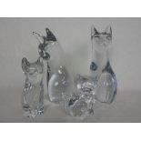 A collection of four Daum glass models of seated cats, each with acid etched mark to base,