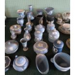 A large quantity of Wedgwood Jasperware, to include: vases, covered bowls, a candlestick and others.