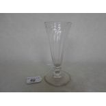 An early 19th century conical drinking glass a swirl design on circular foot, 13cm.