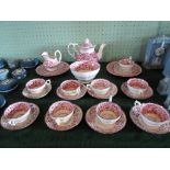 A Victorian pink lustre tea service, a nine place setting, comprising: teapot, cups & saucers,